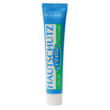 A tube from DR.SCHNELL GmbH & Co. KGaA DR.SCHNELL'S SKIN PROTECTION CREAM (50 x 50 ml) in the colors blue, green, and white is labeled in German, identifying it as a light protective cream for the skin.