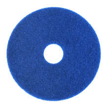 A blue, round Arcora Superpad Blue cleaning pad from Arcora International GmbH with a rough surface and center hole, designed for use on sensitive floor coverings, depicted against a white background.