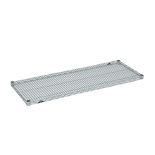 The Novocal stainless steel grid shelf for the sterile goods trolley is characterized by a rectangular, grid-shaped surface with cut-off corners, ensuring hygienic storage, shown isolated on a white background.