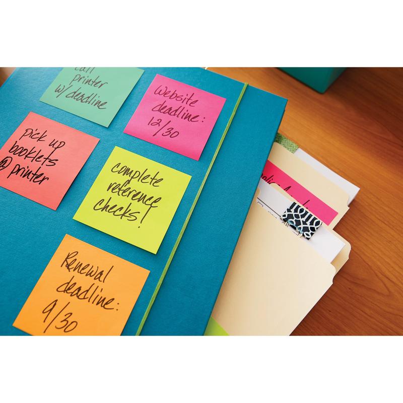 A blue folder holds colorful Post-it® notes from 3M Deutschland GmbH from the Poptimistic Collection (38 mm x 51 mm, 12-pack, 100% PEFC), on which tasks like reference checks and deadlines are noted, next to several file folders on a desk.