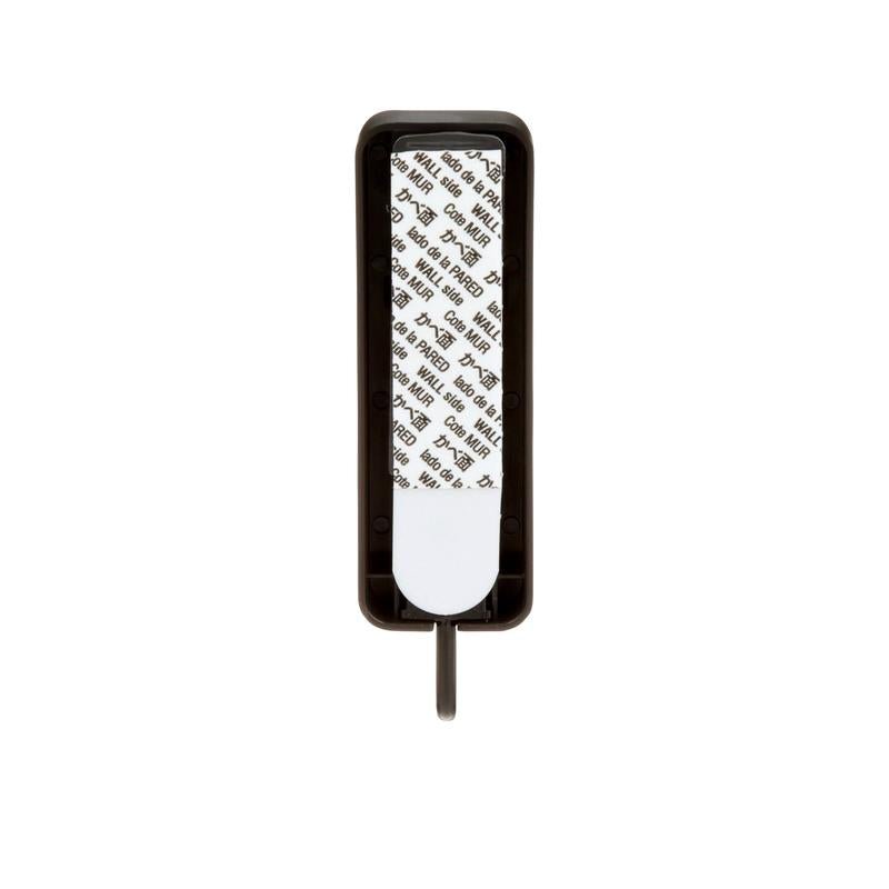 The medium-sized Command™ matte black hook, 17034B from 3M Deutschland GmbH is rectangular, matte black, and shown on a white background with partially visible adhesive strip as a removable wall hook without drilling.