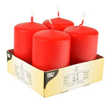 Starpak 4 pillar candles, Ø 50 mm · 80 mm, “Ivory,” with flat tops, are arranged in a lightweight cardboard tray with product information printed on the side in multiple languages; each candle has a white wick.