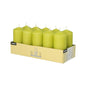 A cardboard tray labeled "Starpak 10 pillar candles Ø 40 mm · 90 mm" contains ten yellow-green candles in two rows of five each. Each candle has a visible wick, offers a long burning time, and creates a romantic atmosphere. Brand: Starpak.