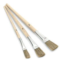 Three Nölle Profi Brush enamel paint brushes (10-14 mm, sizes 0, 2, 3) with wooden handles and natural bristles from Nölle Profi Brush Bürsten- & Pinseltechnik e.K. are arranged by size on a white background.