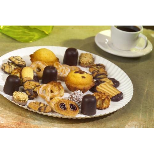 A plate from PAPSTAR GmbH PAPSTAR 100, cardboard "pure" round presents cookies, pastries, and chocolate treats. Behind it rests a white cup with black coffee on a saucer.