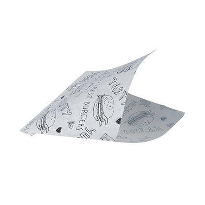A PAPSTAR 1000 hamburger bag sheet (parchment substitute, greaseproof) from PAPSTAR GmbH, white like newspaper, shows black burger illustrations, "TASTY", hearts, and doodles, with two corners slightly raised as if folded or floating.