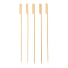 Five PAPSTAR grill skewers "pure" made of wood (25 cm) from PAPSTAR GmbH with a flat, beveled head and pointed tip lying side by side on a white background. Ideal for BBQ and grill parties, available in a cardboard tray (150 pieces).