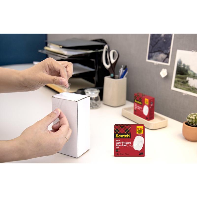 A person seals a white box with office supplies with Scotch® Super-Hold Secure Tape, 1 roll, 19 mm x 25.4 m from 3M Deutschland GmbH. The tape packaging is inserted in the lower right corner.