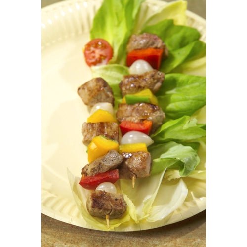 A skewer with grilled meat, peppers, tomatoes, and onions rests on a beige salad plate, served with PAPSTAR wooden skewers "pure" Ø 3 mm, 20 cm (1000 pieces) from PAPSTAR GmbH for an eco-friendly touch.