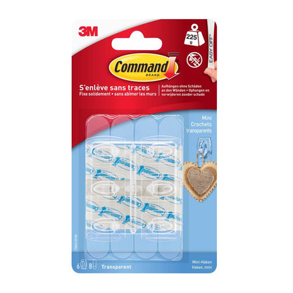 A pack of Command™ Mini Hooks, transparent, 17006CLR from 3M Deutschland GmbH contains 6 transparent hooks and 8 transparent strips. The blue-red packaging has French and English info, perfect for leaving no trace in your space.
