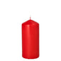 A single, unlit Starpak pillar candle with extra long burning time (Ø 60 mm, 130 mm) with a smooth red surface and centered white wick stands upright against a plain white background.