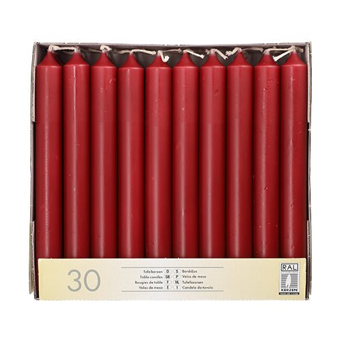The Starpak 30 table candles Ø 2.1 cm · 19.6 cm are delivered in a box with a yellow Starpak label and RAL quality mark – perfect for festive table decoration.