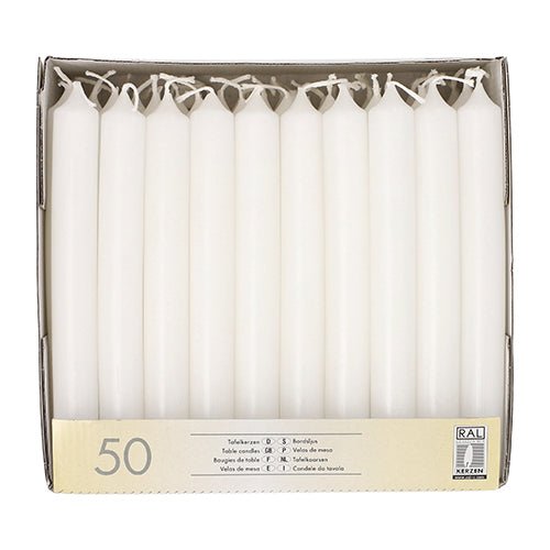 A box of 50 Starpak table candles (Ø 2.1 cm · 19.6 cm) in white, upright in a cardboard tray. Each candle is unused with an intact wick; the packaging features multilingual product information for an elegant atmosphere.