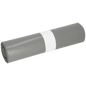 A roll of EMIL DEISS KG (GmbH + Co.) DEISS 14005 - 700x1100x0.06 mm gray garbage bags (25 pieces) with white paper band lies on a white background-perfect for packaging and shipping thanks to the robust film roll.