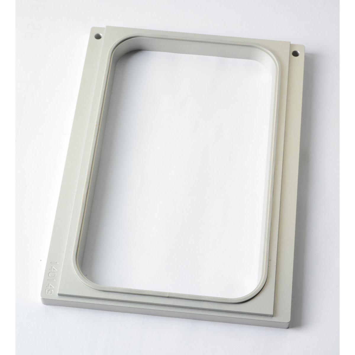 The Duni GmbH cassette DF10/20 is a rectangular, light gray frame with rounded inner corners and four screw holes, perfect for organizing PP trays 265x162x50 or 265x162x70 mm as a practical storage solution. The package contains 1 piece.