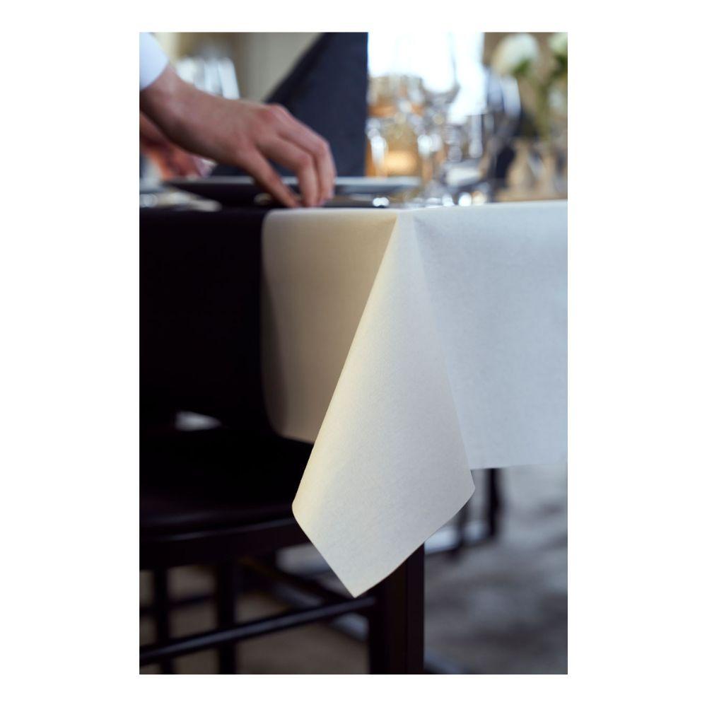 A person places a plate on a table covered with a 1.18 m x 10 m tablecloth from Duni GmbH Dunicel tablecloth rolls, whose white elegance at the corner creates an ideal setting for weddings, banquets, or corporate events.
