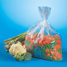 A transparent Starpak 24 freezer bag (LLDPE, 10 l, 60 x 40 cm) contains frozen mixed vegetables—mainly carrots and peas—with asparagus, cauliflower, and broccoli in the foreground against a blue background. Ideal for food storage.