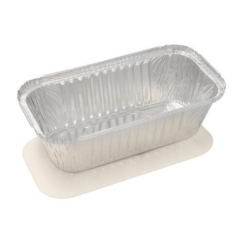 A rectangular disposable aluminum tray Starpak 10 trays with PP coating and insert lid with wavy edges and smooth surface stands on white cardboard - perfect for storing food.