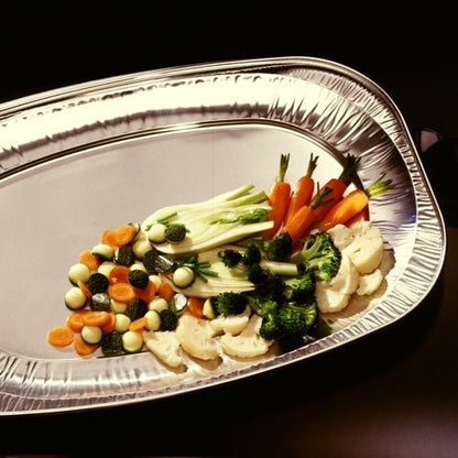 The Starpak 10 serving platters, aluminum oval by Starpak present steamed vegetables – carrots, zucchini, broccoli, cauliflower, and small onions – elegantly and are ideal for buffets, catering, or stylish wedding receptions.