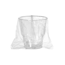 A transparent toothbrush glass from Duni GmbH (PS, individually wrapped for hygiene) sits centrally on a white background with a clear plastic bag - ideal for stylish organization in the bathroom.