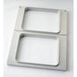 The Duni GmbH cassette DF15/25 for CPET trays 960-1500 ml - 2-use is a rectangular metal frame with two vertically arranged openings, brushed finish and rounded edges - perfect for storing CPET trays on any white surface.