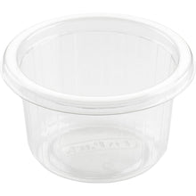 The Duni GmbH Dressing Cup Fixpack Transparent APET 80x80x46 mm (Pack of 50 pieces) is a small, ribbed, wide-rimmed container, ideal for sauces or spices, shown empty on a white background.