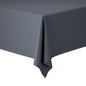 A close-up of the corner of a rectangular table covered with an elegant Evolin tablecloth 127 x 180 cm from Duni GmbH. The background is white, the fabric is gently draped over the edge.