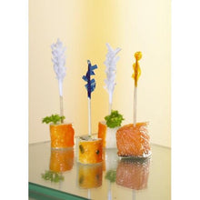 Four bite-sized appetizers are served, each skewered with a PAPSTAR 1000 decoration pick 6.8 cm "Frills" from PAPSTAR GmbH, with fish and vegetables, garnished with parsley for an elegant presentation.