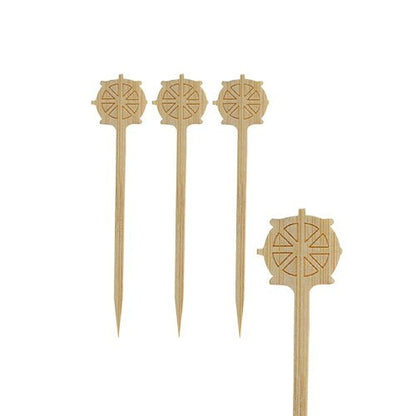 Four PAPSTAR finger food picks "Steering Wheel", 9 cm, with engraved wheel motifs of the PAPSTAR GmbH are arranged on a white background. Pointed at one end and flat at the other, they are perfect for party catering.