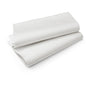 Two neatly folded Duni GmbH Evolin tablecloths 127 x 220 cm lie on a flat surface, emphasizing their smooth structure and clean edges - perfect as a high-quality tablecloth for elegant tables.