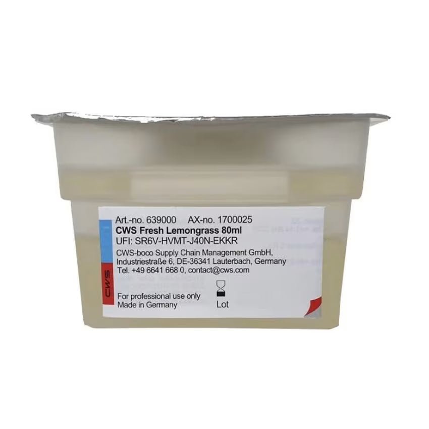 A sealed plastic container labeled "CWS ParadiseLine Washroom Fragrance for Fragrance Dispenser Paradise Air Bar" by CWS, with a foil lid and contact label, intended for professional use of washroom fragrance only.