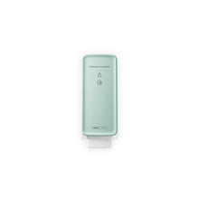 The CWS PureLine front panel for the surface cleaner toilet by CWS is a light green, wall-mounted dispenser with modern design, a push lever at the bottom, and simple black lettering/symbols that stand out against a plain white background.