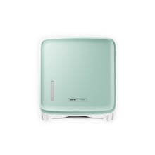 A square, wall-mounted mint green CWS PureLine front panel for the CWS paper dispenser features a small oval window and a CMS logo on the front, depicted against a white background.