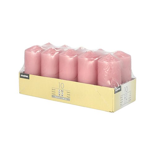 The Starpak 10 pillar candles Ø 40 mm · 90 mm, pink, are neatly arranged in transparent plastic and an open beige box – perfect for weddings or creating a cozy atmosphere.