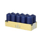 A cardboard tray holds ten upright, dark blue Starpak 10 pillar candles (Ø 40 mm · 90 mm) in two rows of five each. The box displays product information and promises an extended burning time for a romantic mood.