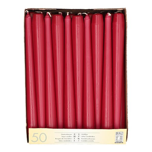 A box with 50 Starpak taper candles (Ø 2.2 cm - 25 cm) white, each with long burning time, arranged in a single layer and labeled with Starpak product information at the bottom.