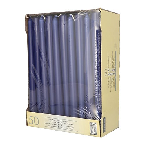 A beige Starpak box contains 50 blue taper candles (Ø 2.2 cm, 25 cm), partially wrapped in clear plastic, with product information on the side and front.
