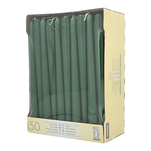 The Starpak box contains 50 green taper candles (Ø 2.2 cm, 25 cm), standing upright and visible through a clear window on the beige packaging, with clear quantity and product labeling.