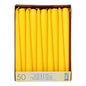 A cardboard box from Starpak contains 50 white taper candles (Ø 2.2 cm - 25 cm), arranged upright in rows. The label on the front contains product information in multiple languages, including "paraffin candles."