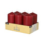 A cardboard tray holds six large Starpak pillar candles (Ø 60 x 115 mm) made from high-quality wax with long burning time in two rows of three, packaged with product details and the Starpak brand name.