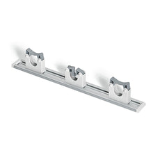 The Nölle Profi Brush HACCP device rail with 3 clamp holders (Ø 20-30 mm) from Nölle Profi Brush Bürsten- & Pinseltechnik e.K. is ideal for safe, organized wall storage of brooms, mops, and cleaning devices.