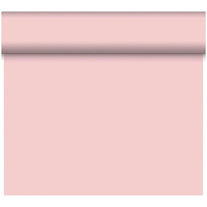 A roll of Dunicel “Tête-à-Tête” table runner (24 m x 0.4 m, 20 sections) from Duni GmbH is unrolled vertically, showcasing its soft pink surface as a stylish table decoration against a white background.
