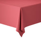Close-up of a rectangular table covered with a solid-colored, dark pink Duni GmbH Evolin tablecloth roll 1.20 m x 20 m, neatly draped as a stylish decoration against a white background.