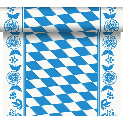 The Dunicel "Tête-à-Tête" table runner (24 m x 0.4 m, 20 sections) from Duni GmbH features a blue-and-white diamond pattern with floral borders and a rolled edge for an elegant table setting.