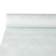 A partially unrolled roll of PAPSTAR GmbH paper tablecloth with damask embossing, white (10 m x 1.2 m), highlights the elegant structure - ideal for the stylishly set table. The simple background draws attention to the high-quality damask embossing.
