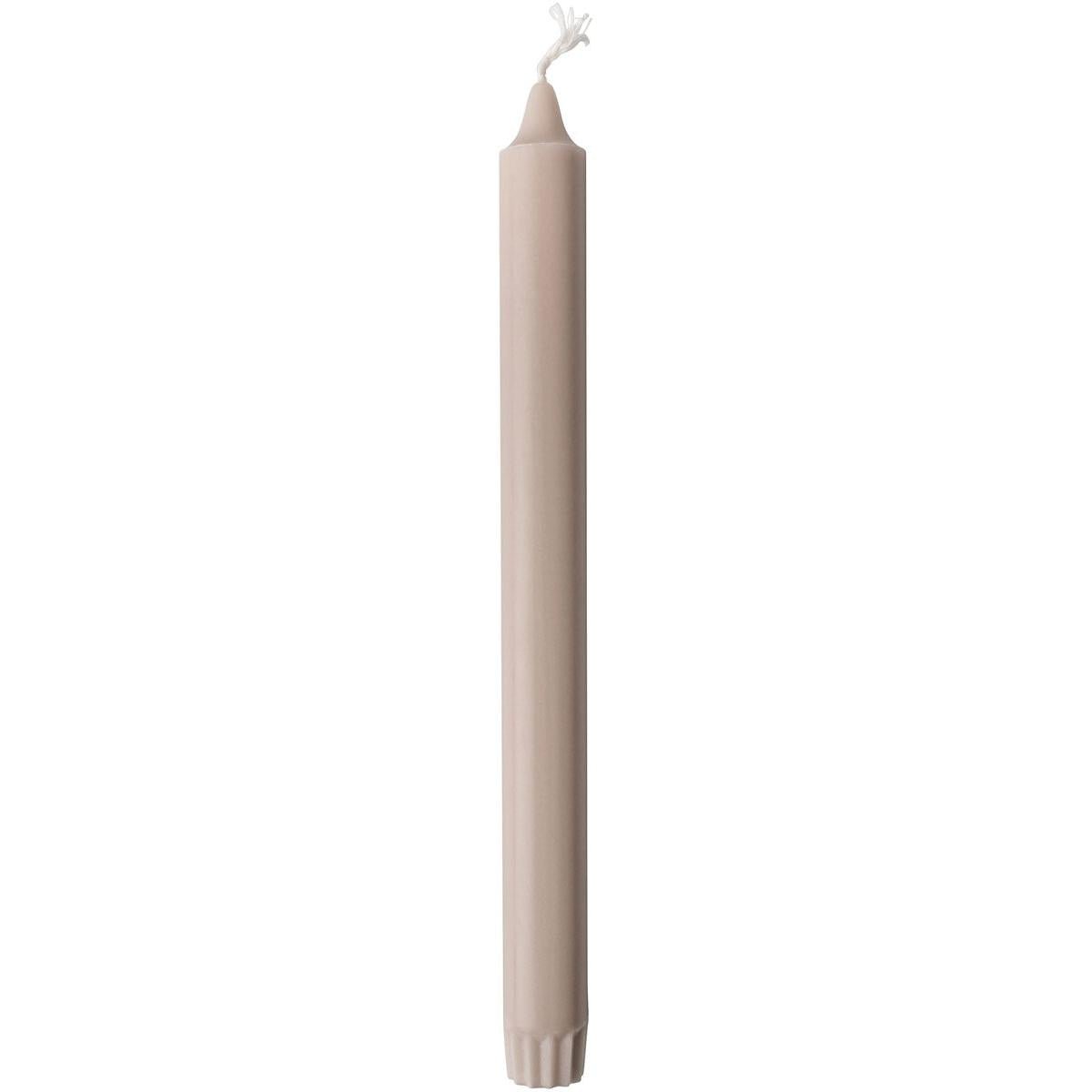 A single, unlit Duni GmbH crown candle made of 100% stearin (250 x 22 mm) stands upright with a visible wick and subtly ribbed base, known for its long burn time of 9 hours.