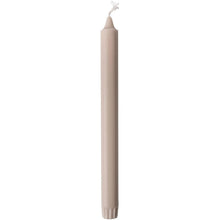 A single, unlit Duni GmbH crown candle made of 100% stearin (250 x 22 mm) stands upright with a visible wick and subtly ribbed base, known for its long burn time of 9 hours.