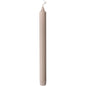 A single, unlit Duni GmbH crown candle made of 100% stearin (250 x 22 mm) stands upright with a visible wick and subtly ribbed base, known for its long burn time of 9 hours.