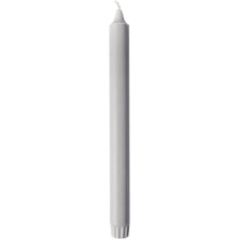 An unused white crown candle 100% stearin pillar candle from Duni GmbH (250 x 22 mm, 9h burn time) with visible wick and ribbed base stands upright against a plain background.