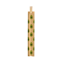 A pair of chopsticks, 210 mm, Avocado by Duni GmbH made of bamboo, partially in a brown paper sleeve with avocado pattern, depicted on a white background. The package contains 100 pieces.